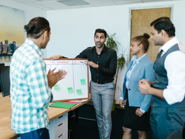 Colleagues walking through a modern office