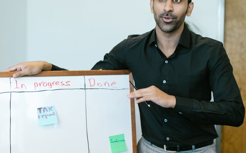 A trainer leading a skills session at a whiteboard